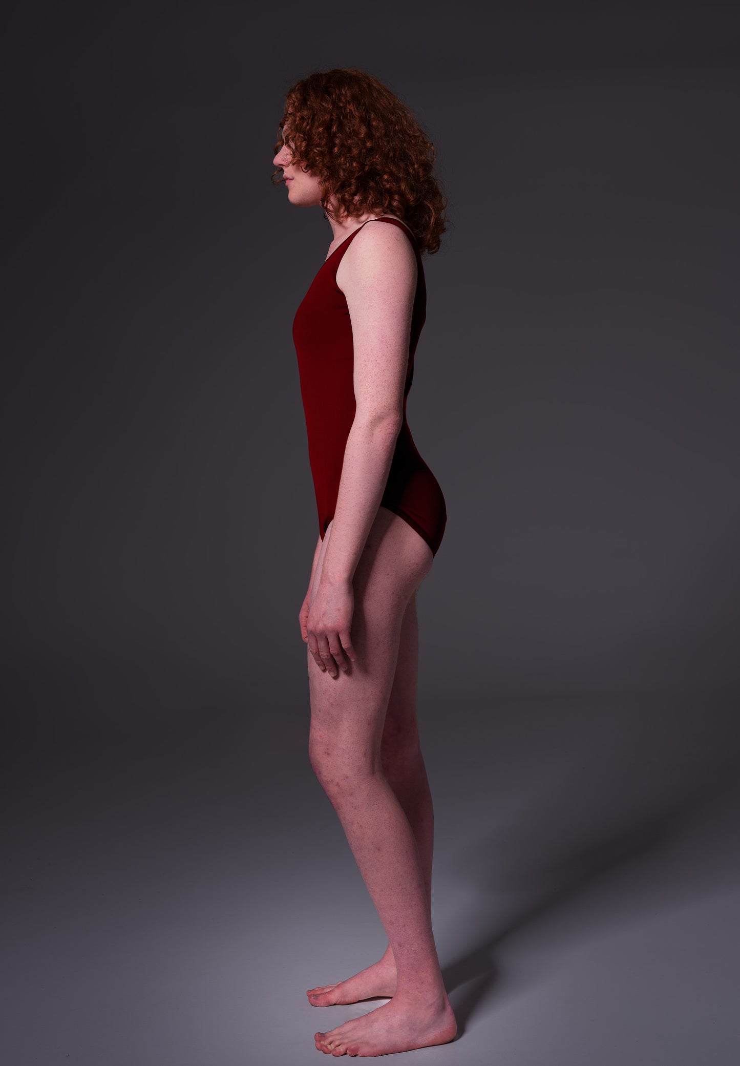 MtF trans swimsuit burgundy color tucking side model shot full 2