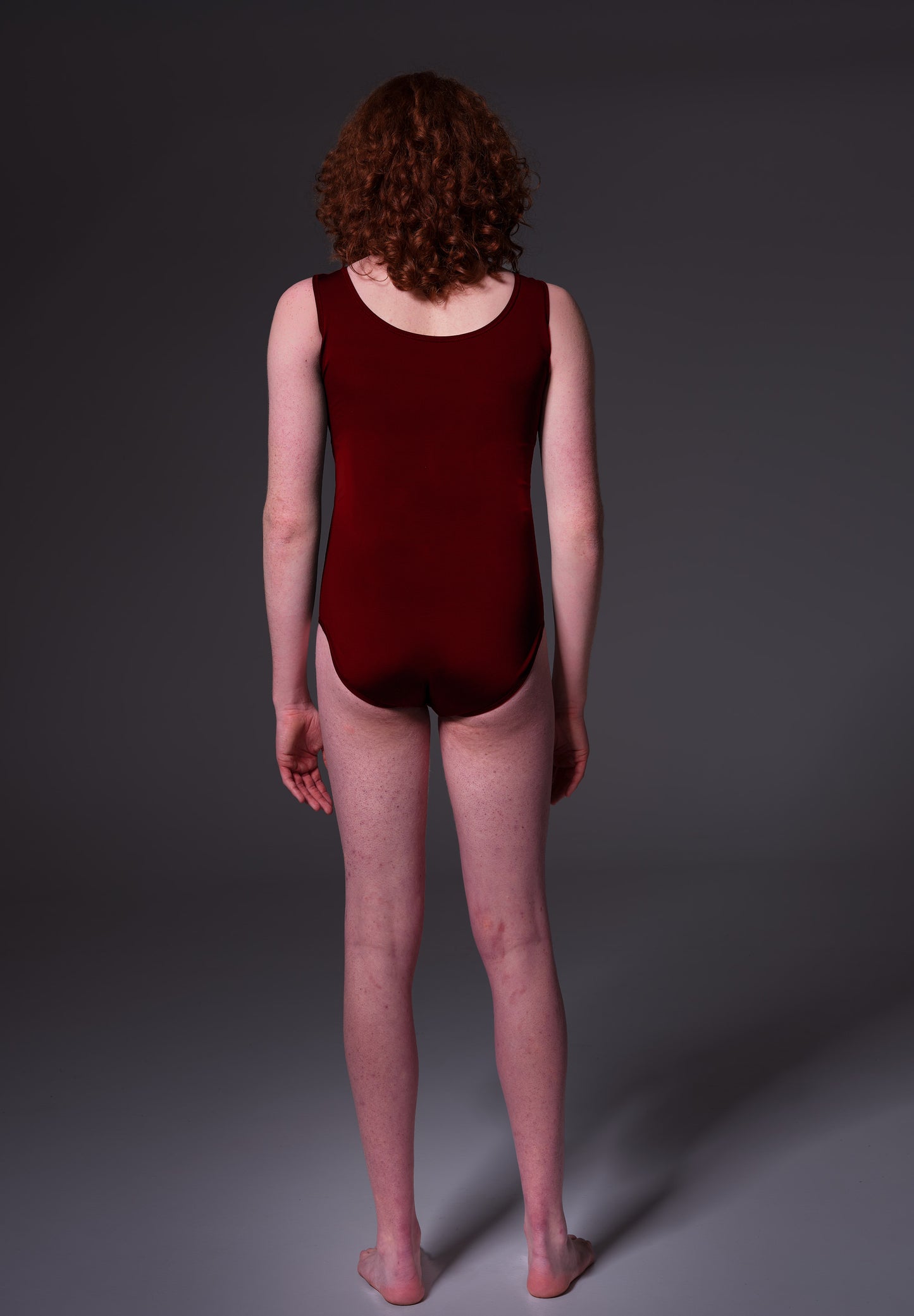 MtF trans swimsuit burgundy color tucking back model shot
