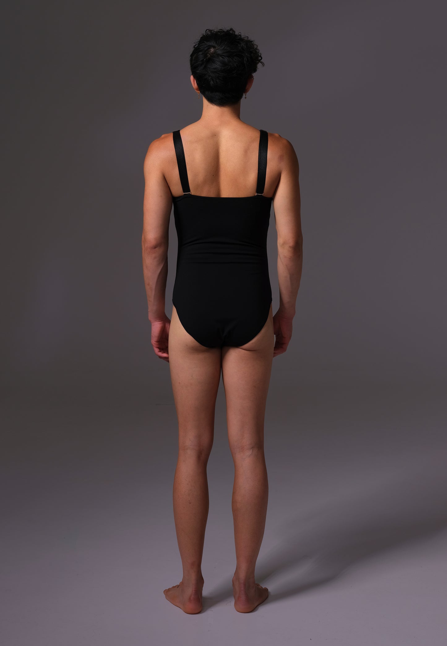 UNTAG MtF trans femme Strappy One Piece black prosthetic boobs back model