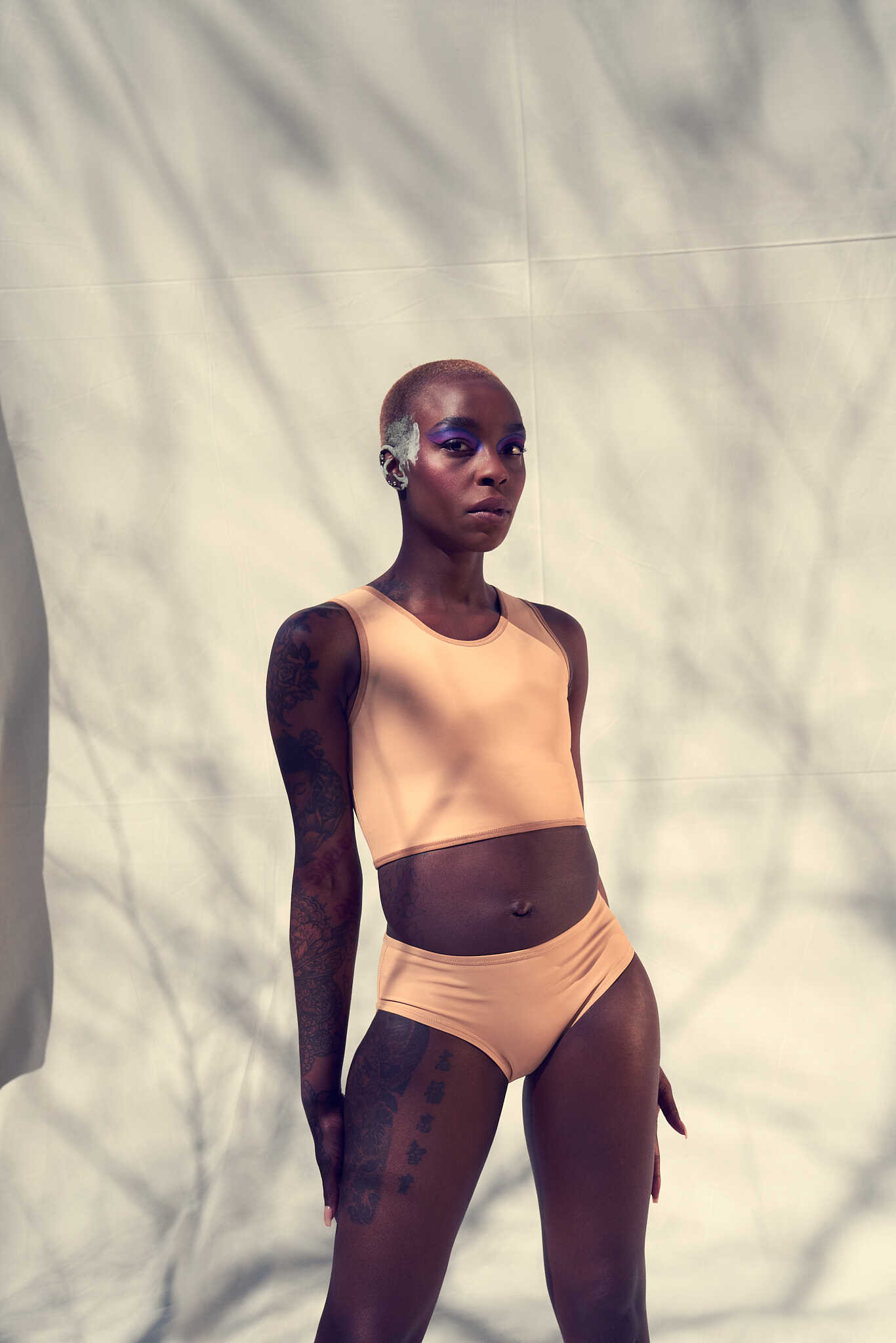 Our dark skinned model Lavinia wears the Short Binder