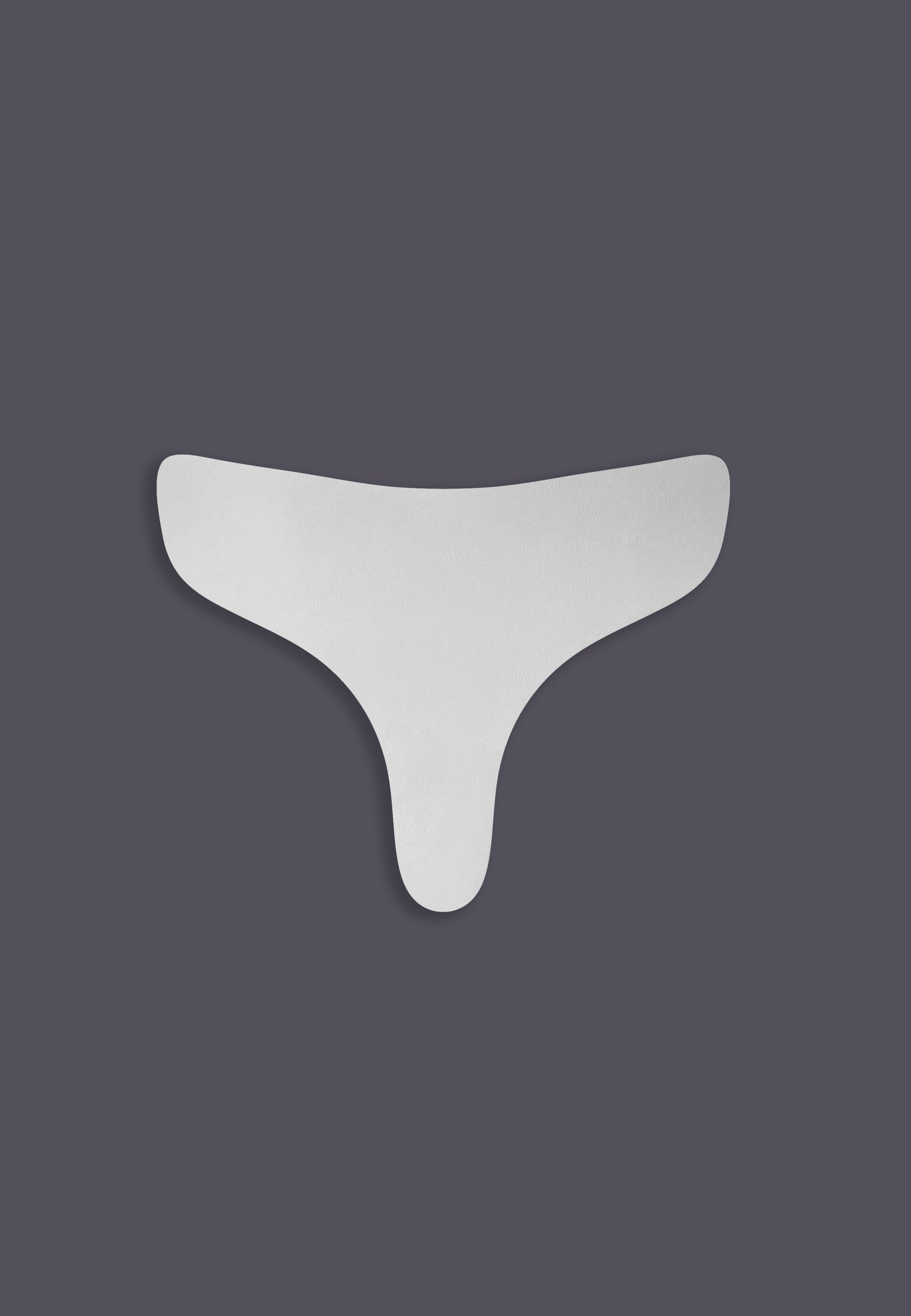 A white, flexible padding, designed to be inserted into tucking panties for corrective padding.
