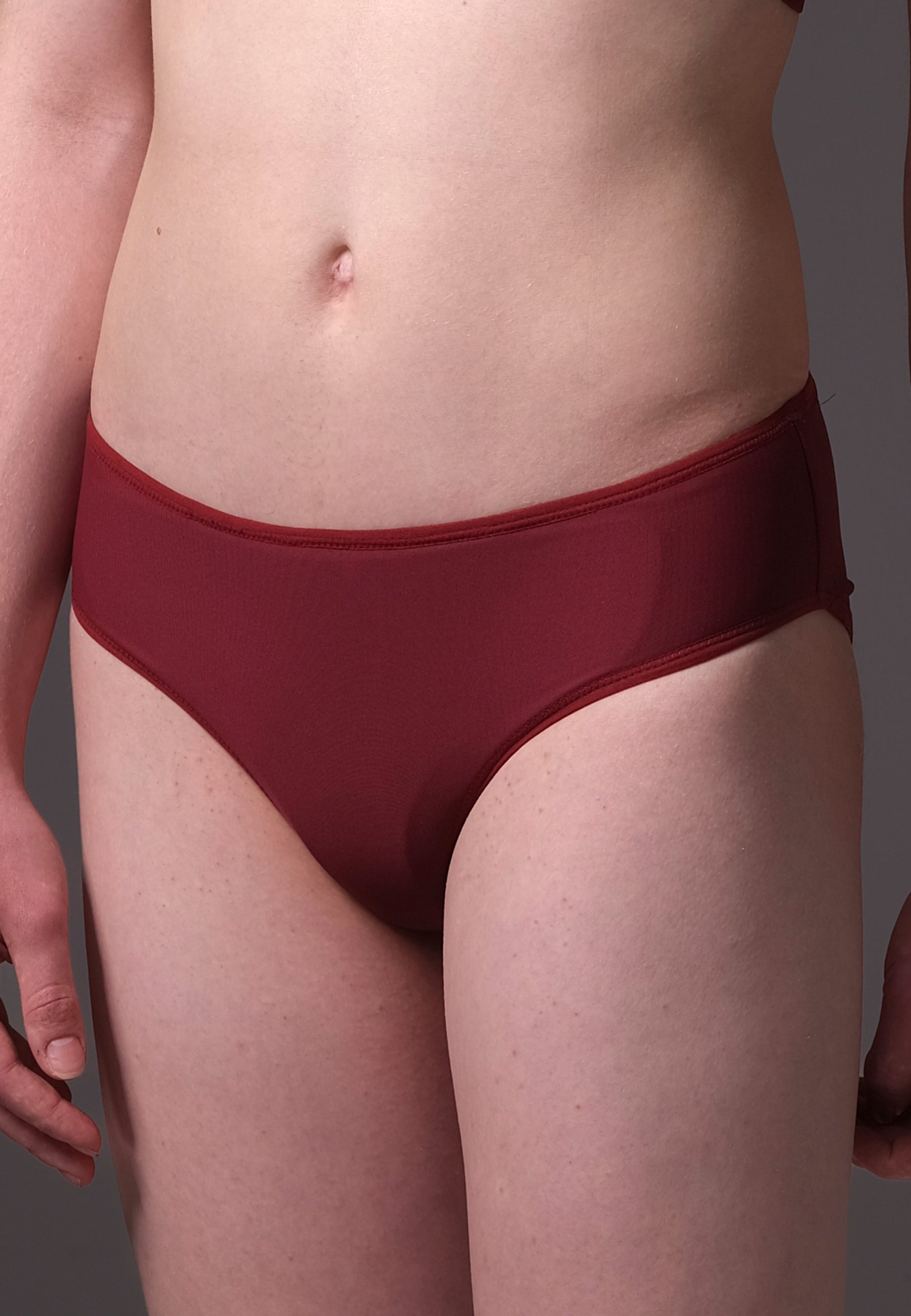 Maroon underwear with the Humphider worn by a person on a gray background