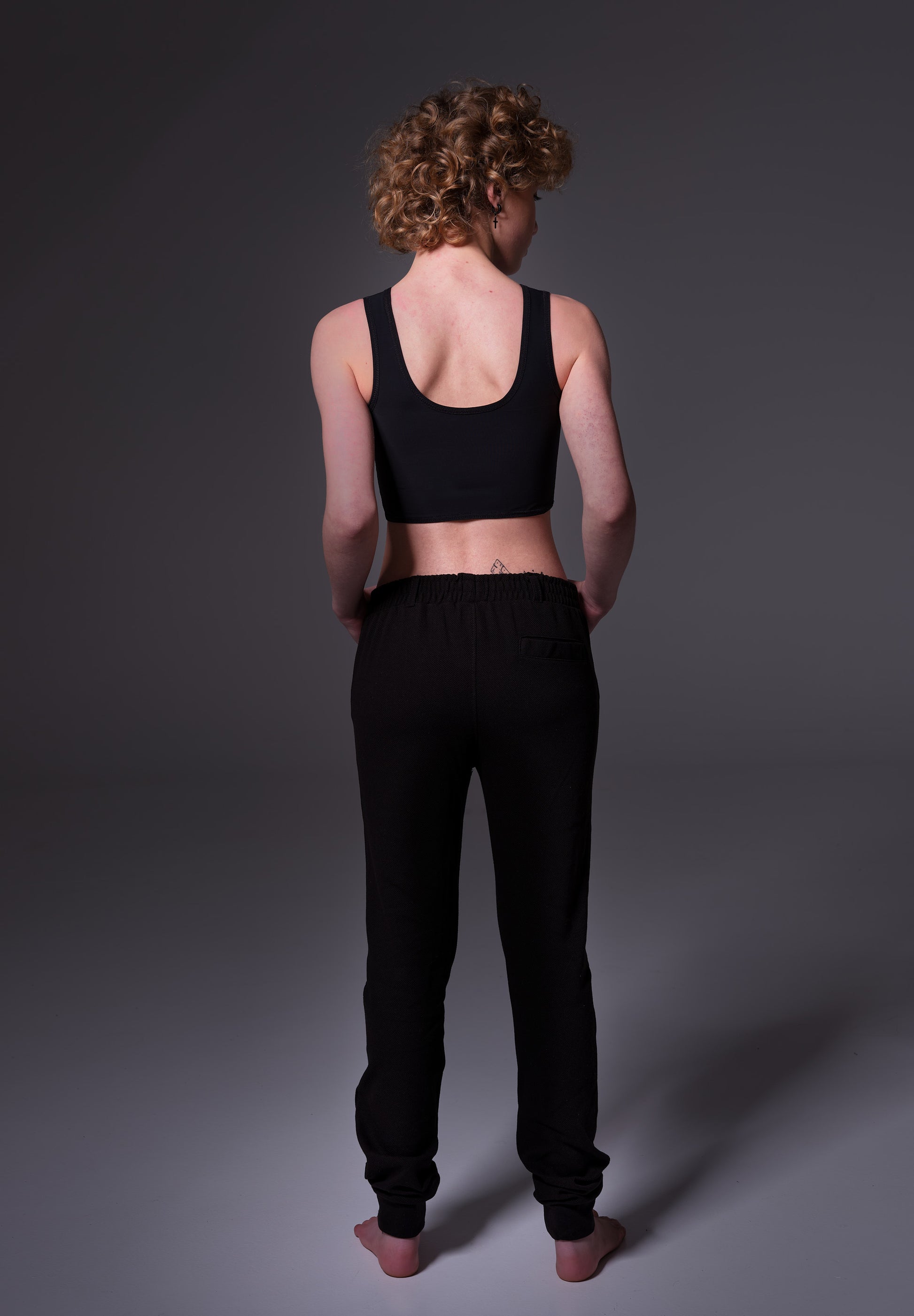 Black Gym binder back view on model Lo