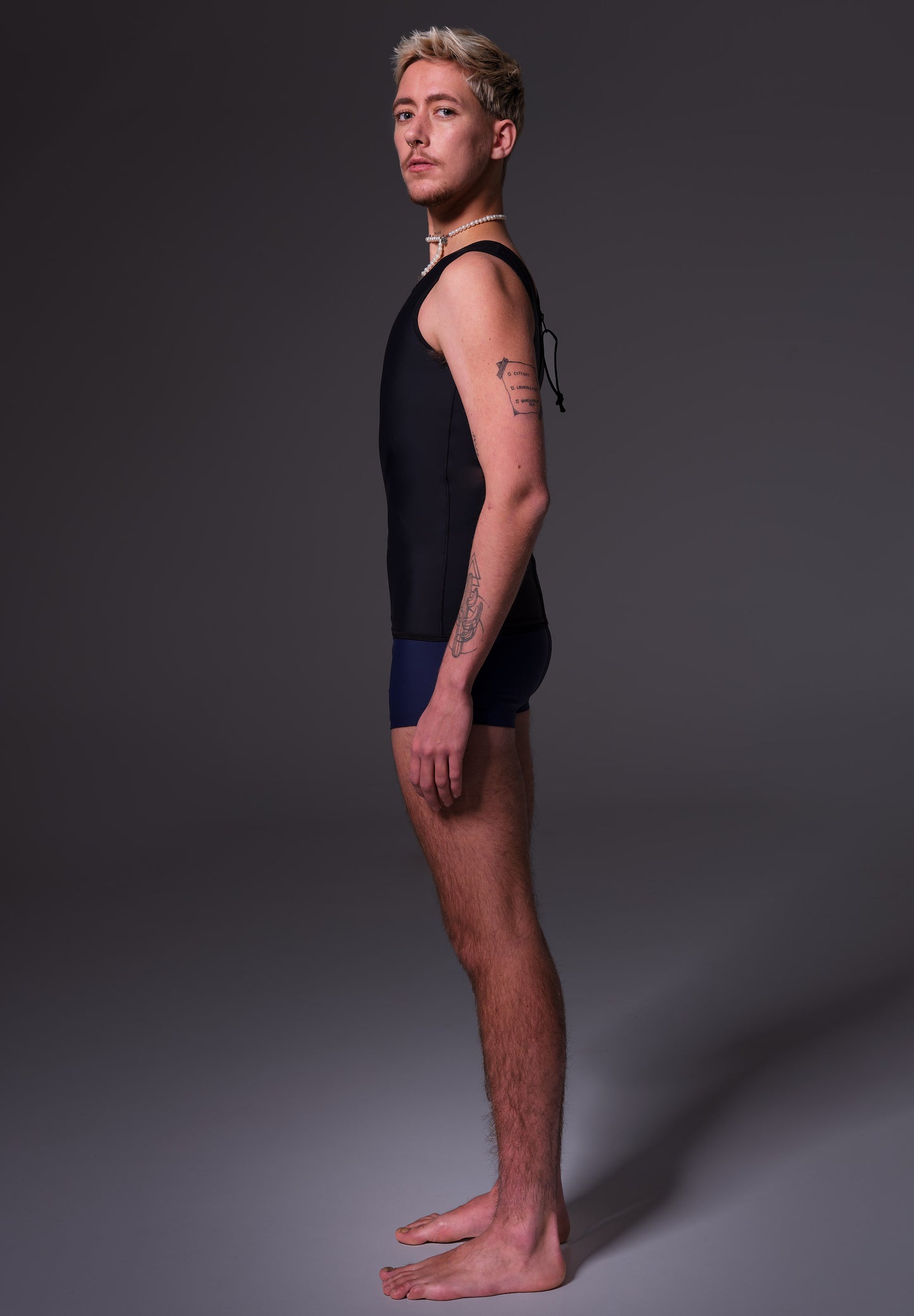 Swimtop Binder black, side view on Mees, by UNTAG