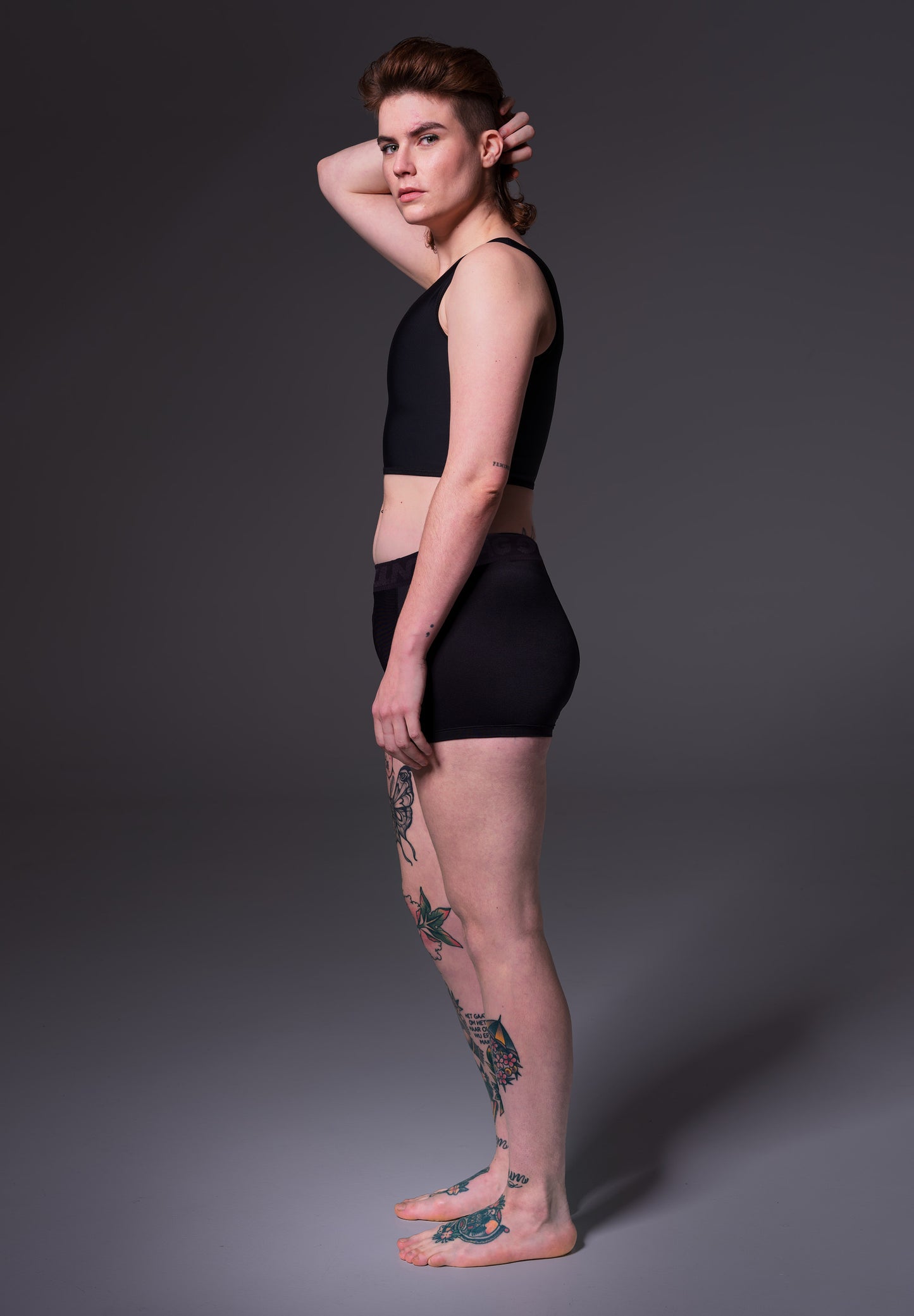 Model Lene wearing the Boxershorts in black, seen from the side, designed by UNTAG