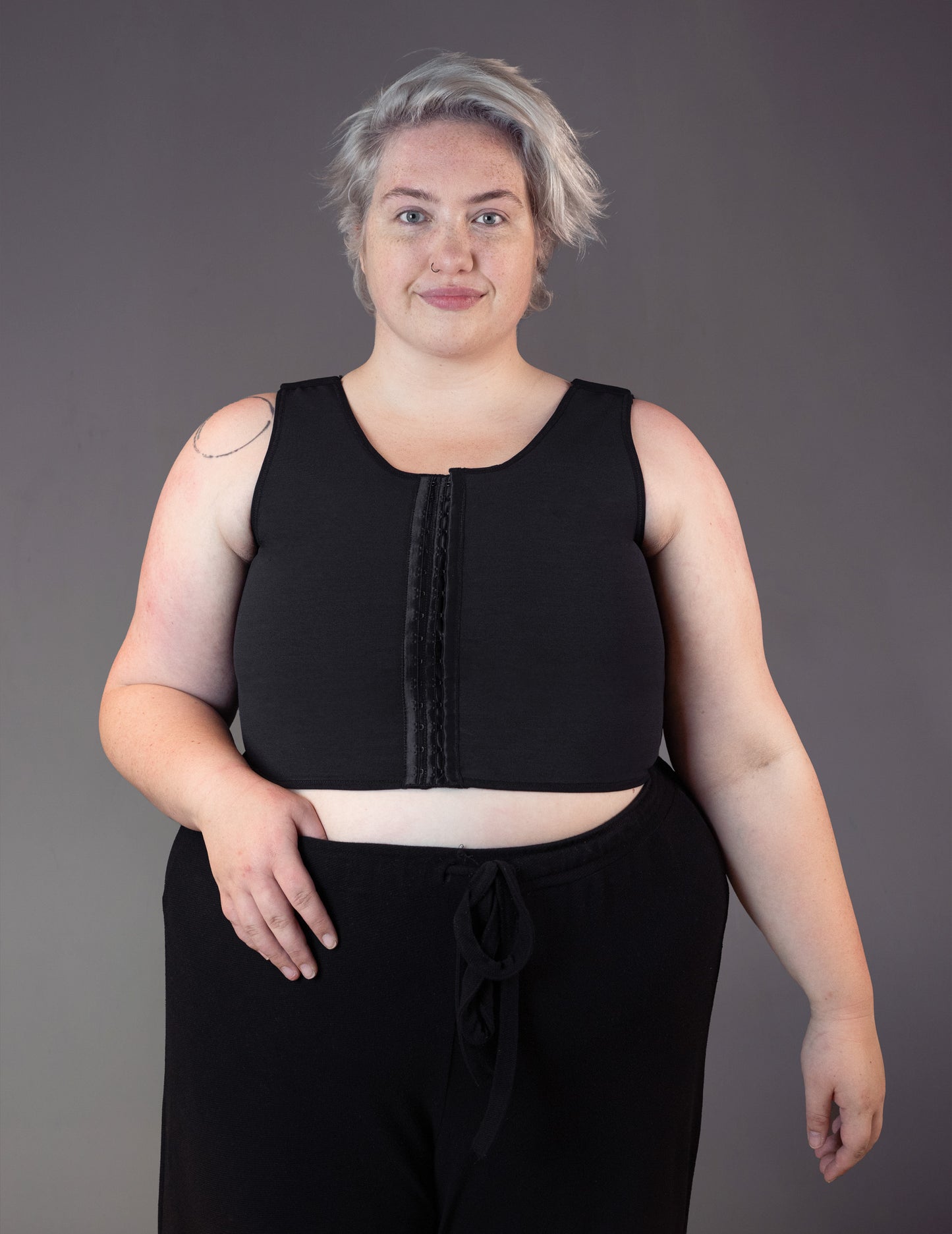 Nonbinary model Jeannette wears a Medical Binder for mastectomy.