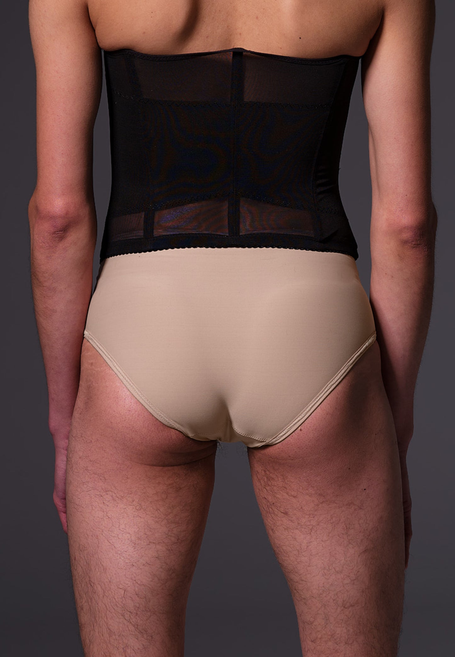 Back view of the beige Tucking Slip by UNTAG