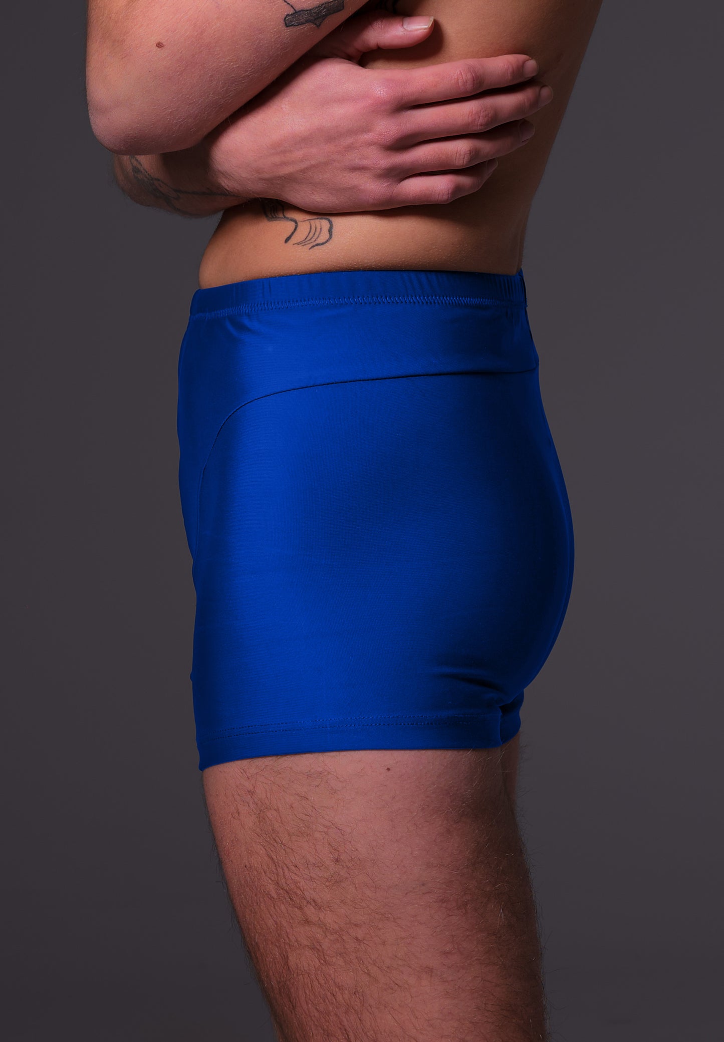 UNTAG FtM trans masc non binary swim cobalt blue swim shorts packing model side zoom