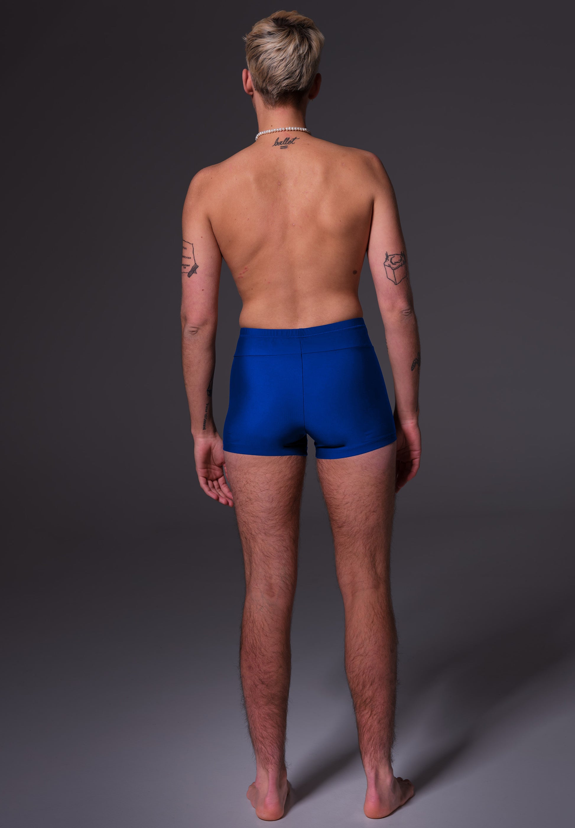 UNTAG FtM trans masc non binary swim cobalt blue swim shorts packing model back 2