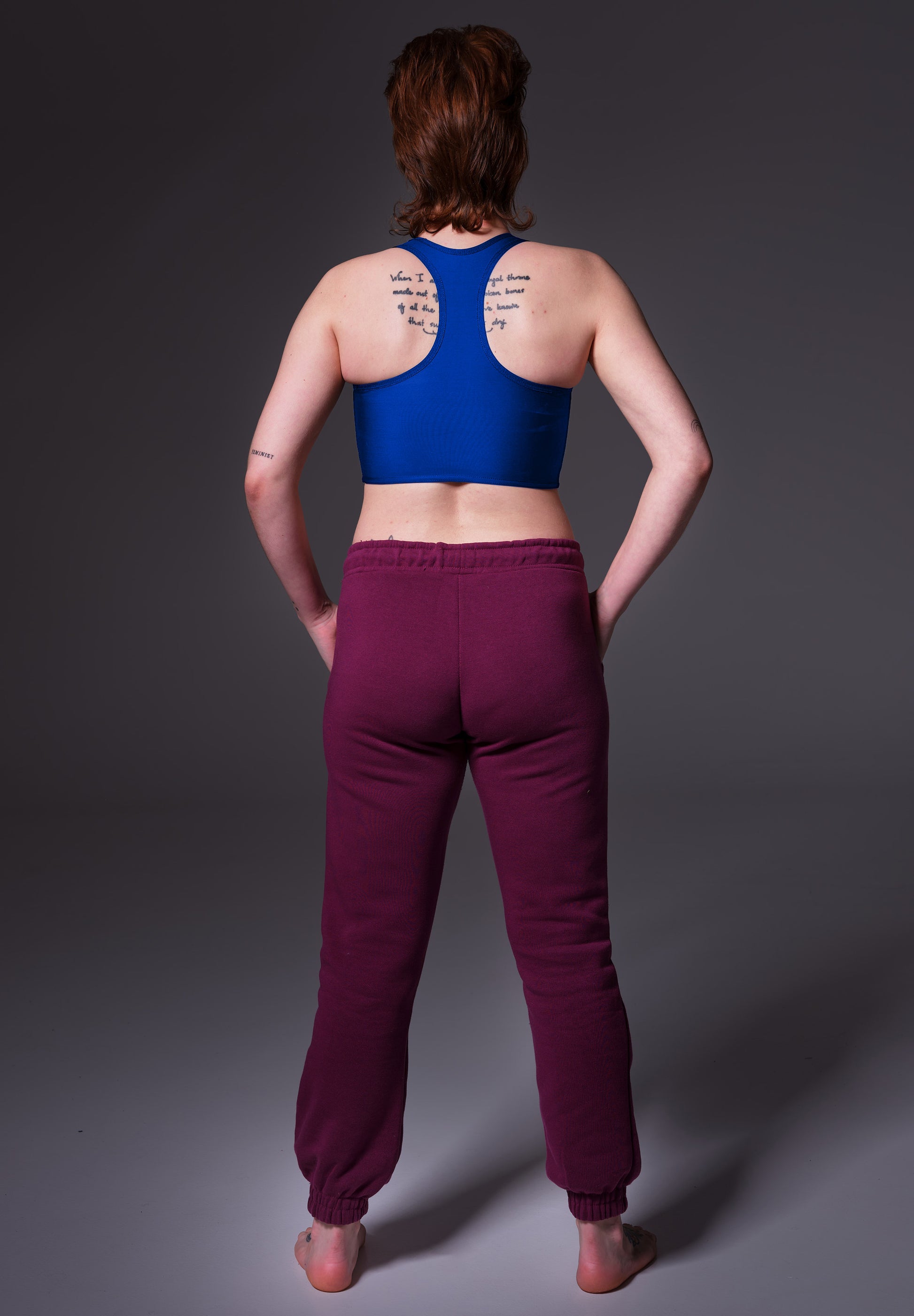 UNTAG FtM trans masc non binary swim cobalt blue chest binder tank top model back