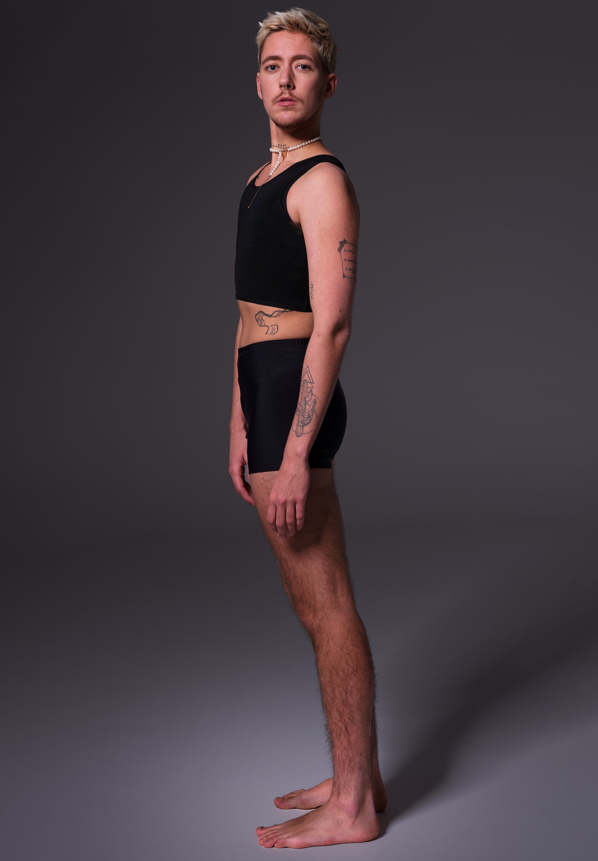 Swim Shorts black, side view modeled by Mees