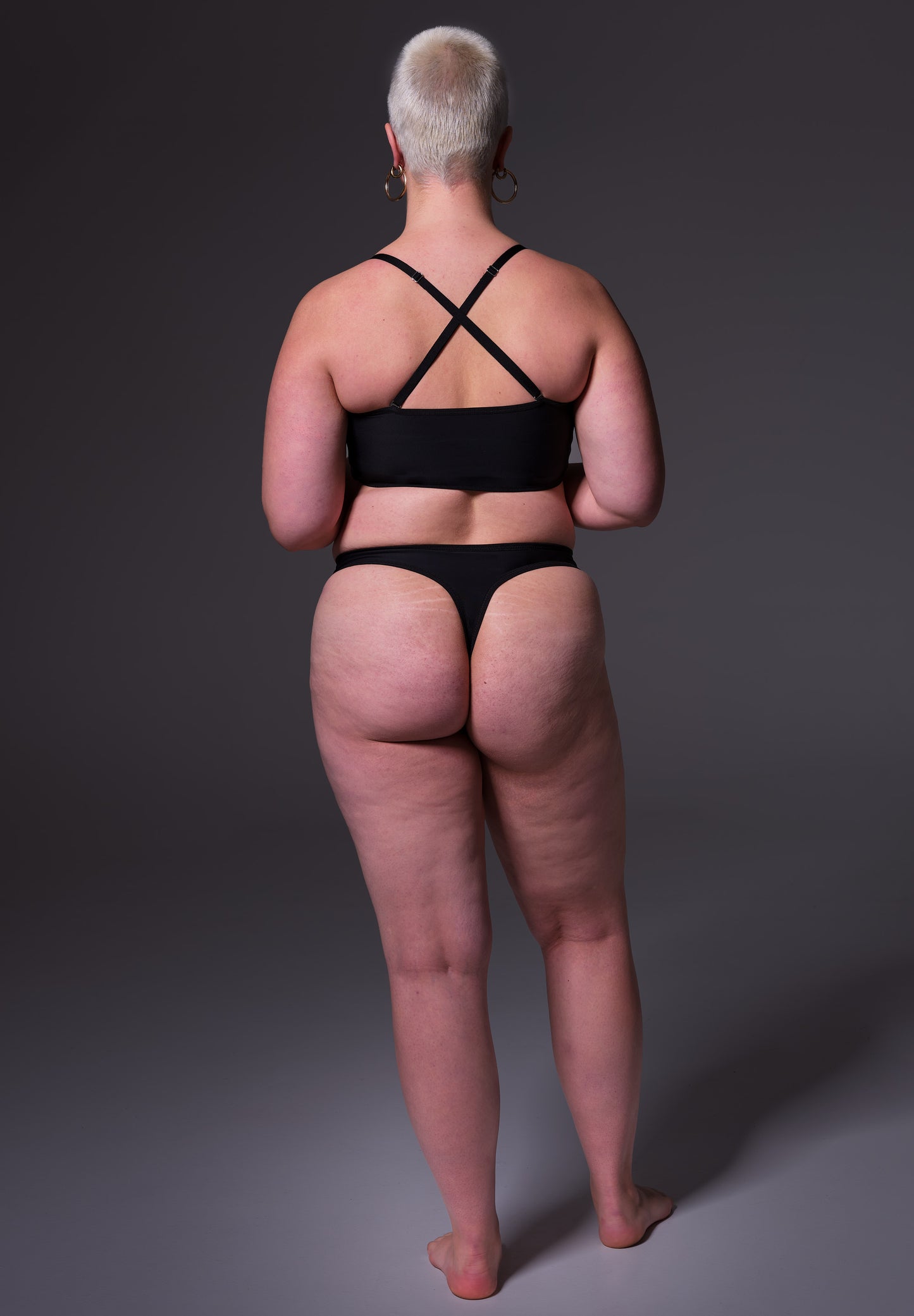 Back of model Sasha wearing the String Extra Strong black by UNTAG