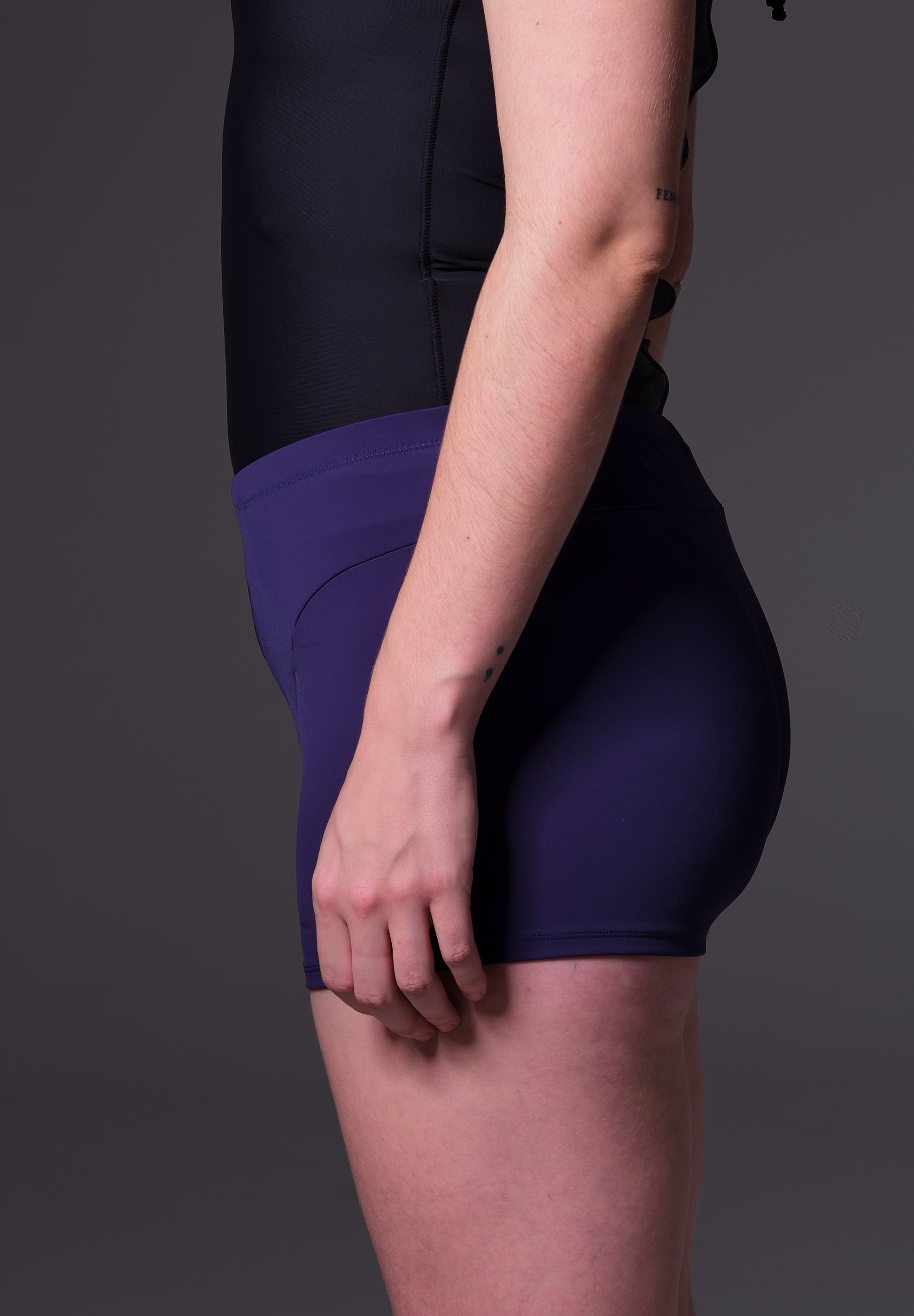 Lene wearing the Swim Shorts dark blue, side view, by UNTAG