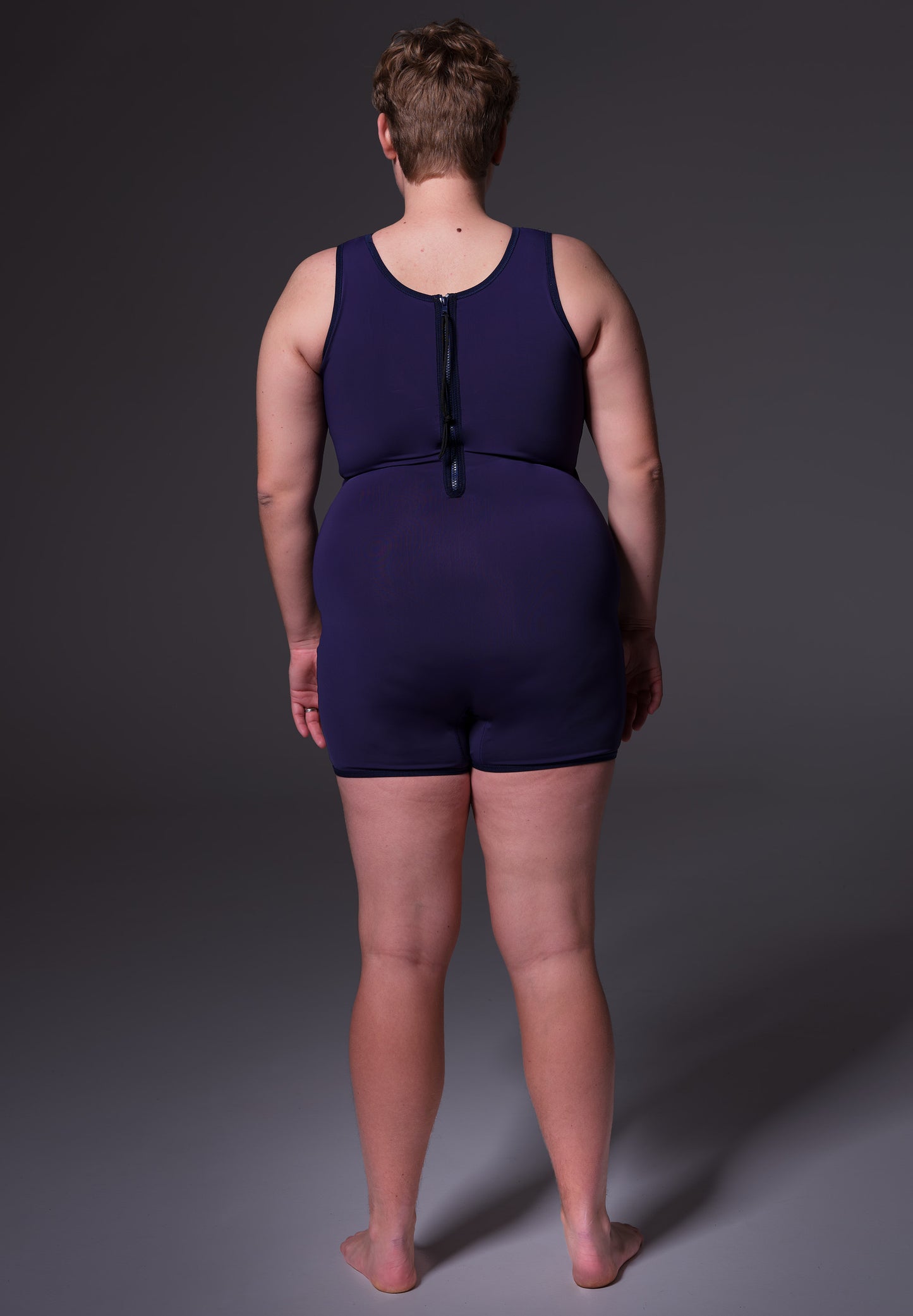 Swimsuit Binder dark blue, back view, modeled by Deven