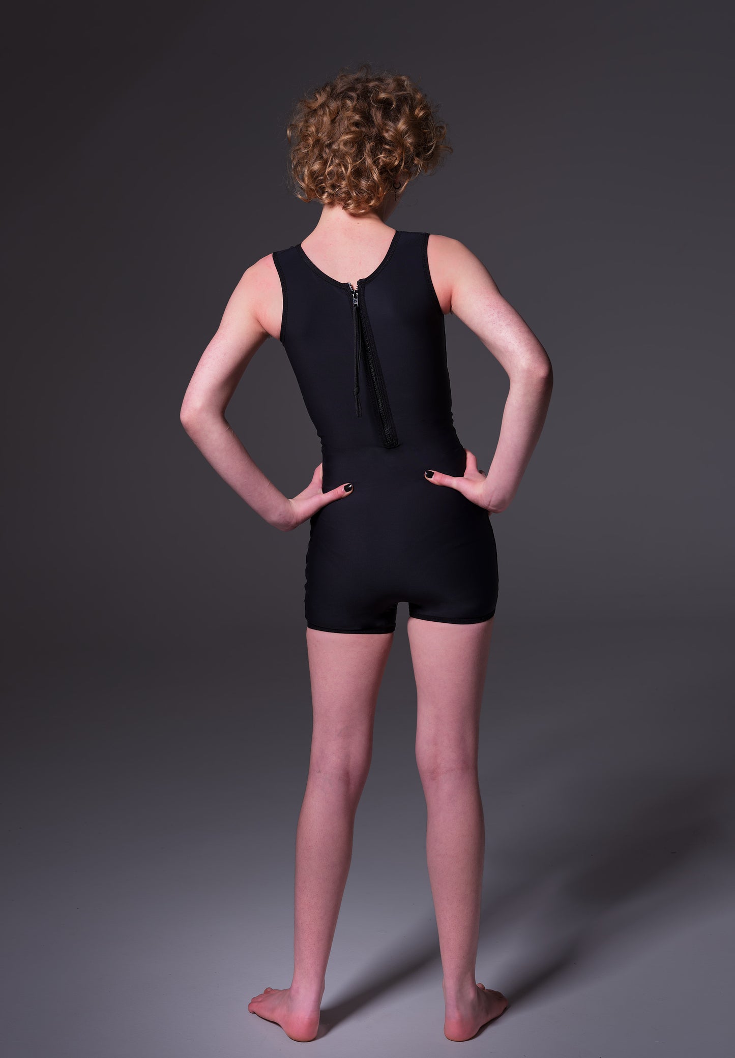 Model Lo wearing the Swimsuit Binder black, back view