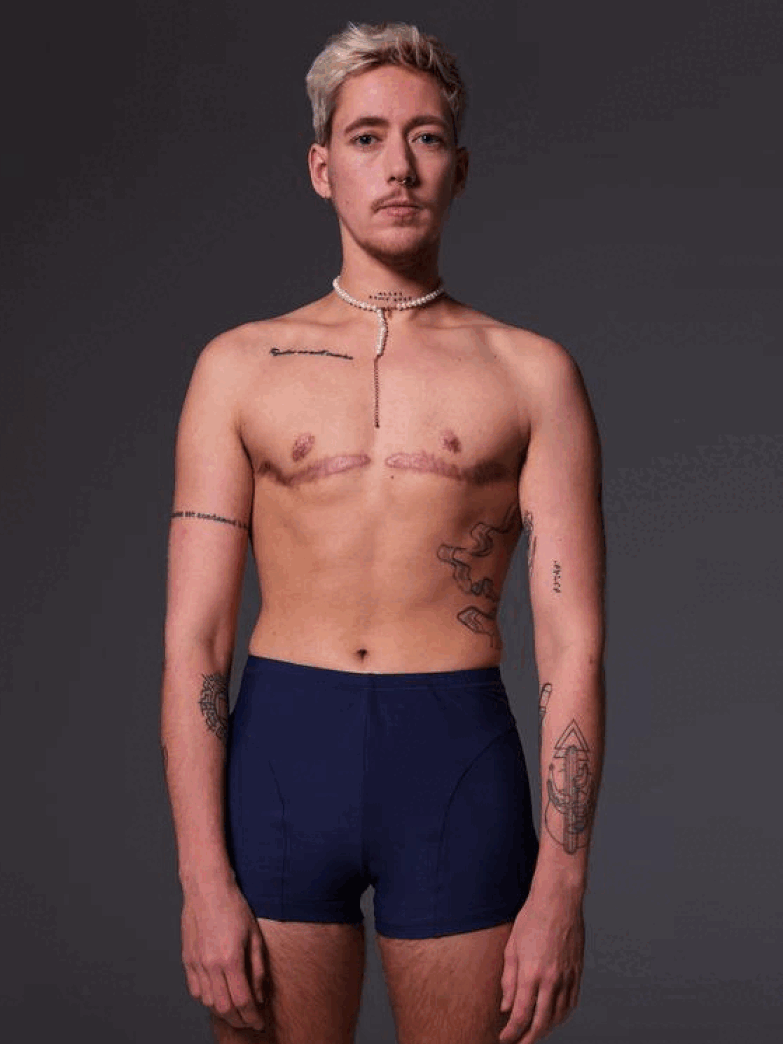 Mees wears the Swim Shorts in dark blue, he is shown from the front, side, and back