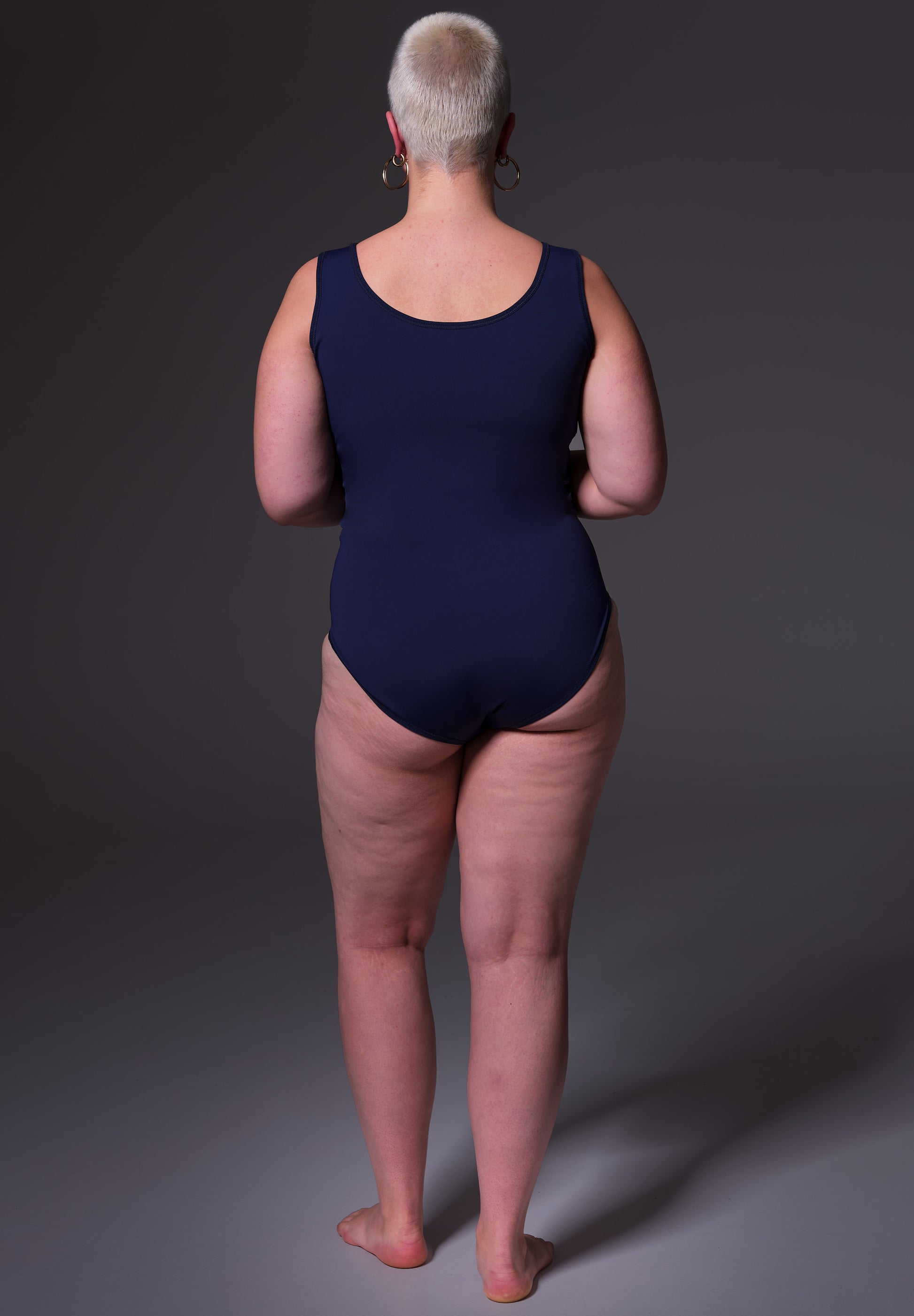 Back view of the Swimsuit dark blue, worn by Sasha