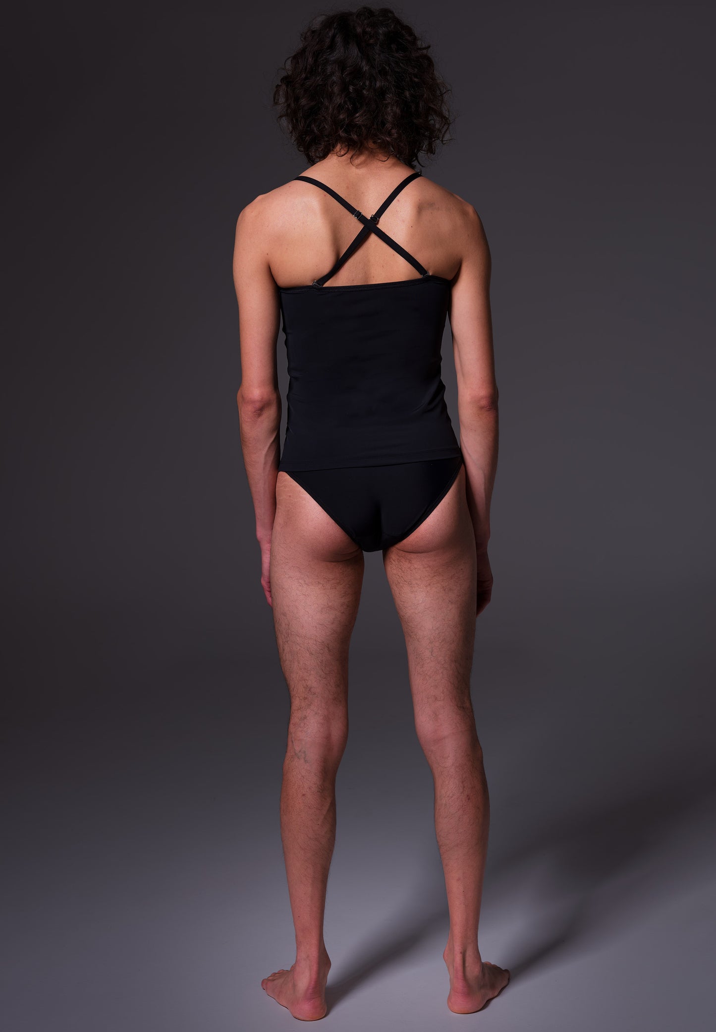 Bikini Singlet Advanced black, seen from the back on model Riah